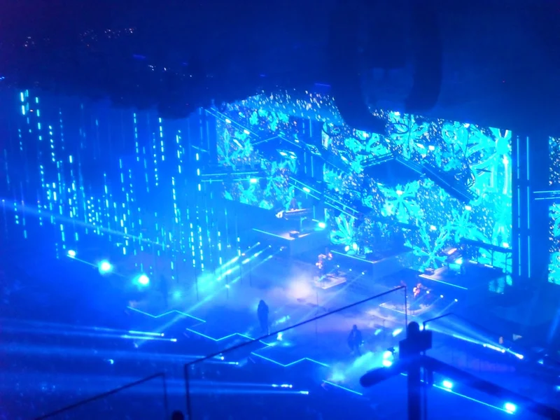 Stage with blue lights and digital patterns